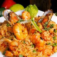 Arroz Con Mariscos · Two of our great culinary loves, seafood and rice come together to create this fantastic dish.