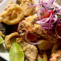 Jalea · A mixture of assorted deep fried seafood and fish accompanied with fried cassava and salsa c...