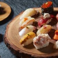 Koya Signature Omakase  · 12 pieces of seasonal nigiri with chef's choice of a 6 piece maki roll. The 12 pieces includ...