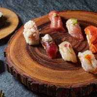 Koya Omakase Midi · 8 pieces of seasonal nigiri with chef's choice of a 6 piece maki roll. The 8 pieces include ...