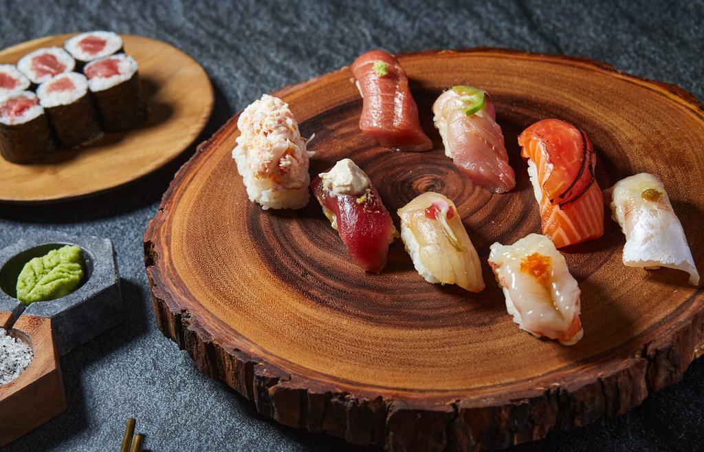 Koya Omakase Midi · 8 pieces of seasonal nigiri with chef's choice of a 6 piece maki roll. The 8 pieces include Toro (Fatty Bluefin Tuna), Akami (Lean Bluefin Tuna), Hamachi (Yellowtail), Sake (Salmon), Suzuki (Striped Bass), A5 Wagyu Beef, Unagi (Freshwater Eel), and Botan-Ebi (Jumbo Sweet Shrimp)