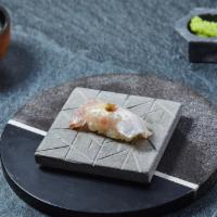 Suzuki Nigiri · Striped bass with yuzu kosho. Served with chef's choice of toppings.