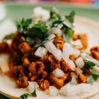 Chorizo Taco · Mexican sausage garnished with cilantro and onions.