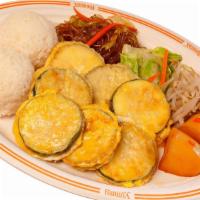 Zucchini Jun · Vegetarian. Zucchini breaded in our egg batter. Served with two scoops of rice.