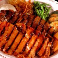 Kalbi Combo Plate · Popular. It comes with Kalbi and your choice of meat. Served with two scoops of rice.