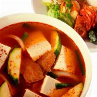 Tofu Soup · Beef soup with Korean hot sauce. Spices, vegetables and tofu. Served with two scoops of rice...