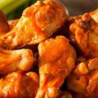 Buffalo Chicken Wings · Fresh chicken wings smothered in a house made tangy buffalo sauce.