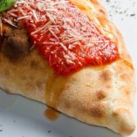 Broccoli Roll · Locally grown broccoli and creamy Mozzarella cheese filled in an oven-baked calzone.