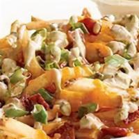 Loaded Fries · French fries with choice of cheese melted on top, onion, bacon, tomato, and sour cream on th...