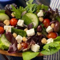Greek Salad · Red onion, grape tomato, olive oil, olives, feta, chickpeas, cucumber, pita, mesclun, lemon-...