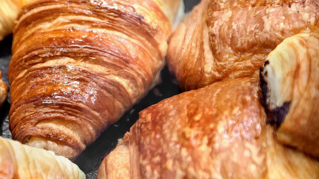 Balthazar Chocolate Croissant · A croissant is a buttery, flaky, viennoiserie pastry of Austrian origin, but mostly associated with France. Croissants are named for their historical crescent shape and, like other viennoiseries are made of a layered yeast leavened dough.