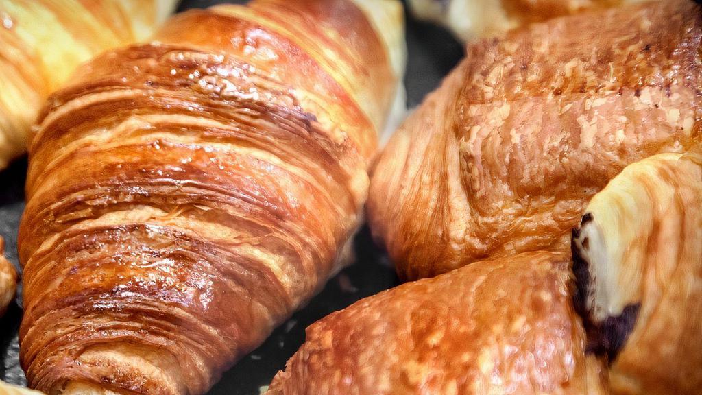 Balthazar Plain Croissant · A croissant is a buttery, flaky, viennoiserie pastry of Austrian origin, but mostly associated with France. Croissants are named for their historical crescent shape and, like other viennoiseries, are made of a layered yeast leavened dough.