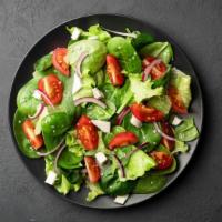 Mixed Greens Salad · Base salad with fresh mix of greens and choice of toppings.