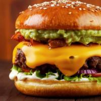 Avocado Bacon Burger · Delicious burger, made with a juicy beef patty topped with fresh avocado, turkey bacon, melt...