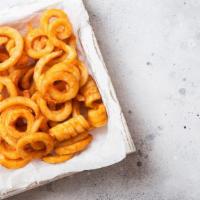 Curly Fries · Golden fried curly fries seasoned to perfection.