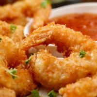 Coconut Shrimp · Juicy shrimp coated with crunchy coconut and breadcrumbs and deep-fried to perfection.
