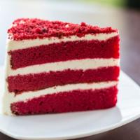 Red Velvet Cake · Traditional, moist, red velvet cake with a hint of cocoa and a classic cream cheese frosting.