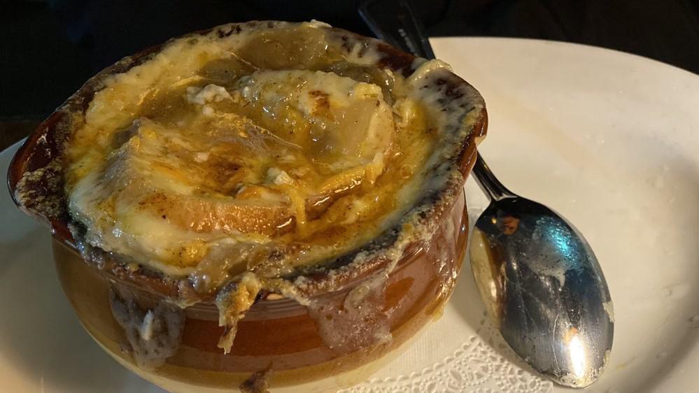 French Onion Soup · Caramelized onions and baguette toast smothered in melted gruyere.
