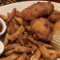 Crispy Guinness Fish & Chips · Guinness battered cod filets, tartar sauce, malt vinegar and fries.