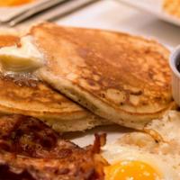 Classic Pancake · Homemade buttermilk pancakes, bacon or sausage served with butter and maple syrup.