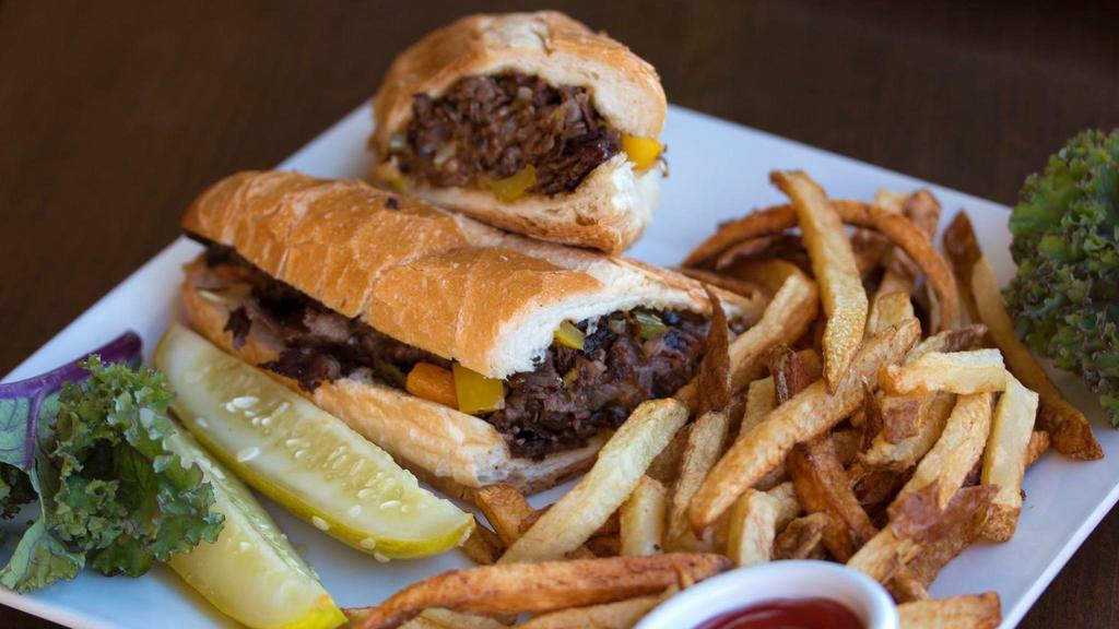 Philly Cheesesteak · Prime roast beef slices with grilled peppers, onions, mushrooms and melted American cheese.