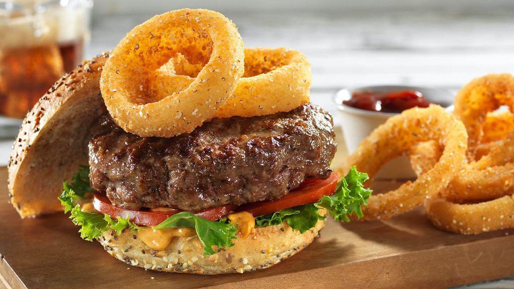 Western Burger  · Fresh Patty, Onion Rings, American & Swiss Cheese, Lettuce and Tomatoes on a Toasted Sesame Seed Bun.