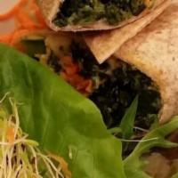 Spinach Burger Wrap · Served with hummus mesclun tomatoes sliced hard-boiled eggs and creamy balsamic. made in a w...