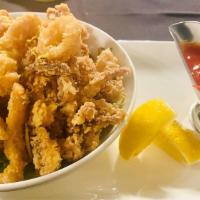 Fried Calamari · Served classically with marinara or tossed in our sweet Thai chili sauce.
