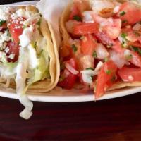 Vegetariano · Refried beans, rice, lettuce, pico de gallo, onions, cilantro, queso fresco & sour cream.