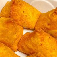 Aloo Samosa (2) · Crisp pastry stuffed with delicately spiced peas and potatoes.