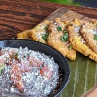 Black Bean Hummus · pico de gallo, queso fresco, tostones