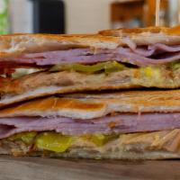 El Cubano · pulled pork, ham, swiss cheese, pickle, garlic mojo.