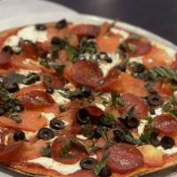 Fra Diavolo Pizzetta · Tomato basil sauce, homemade mozzarella cheese, crumbled spicy sausage, and sliced hot cherr...