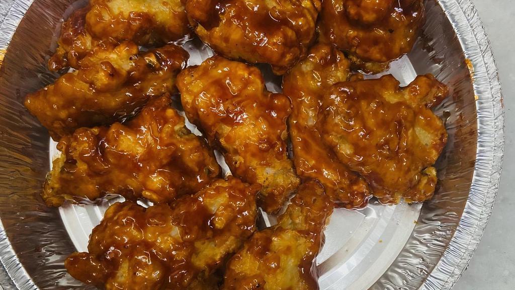 Bbq Chicken Wings · Cooked wing of a chicken coated in sauce or seasoning.