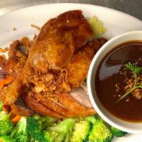 Honey Duck · Crispy half duck served with chef's special black honey sauce and steamed veggies. Please le...