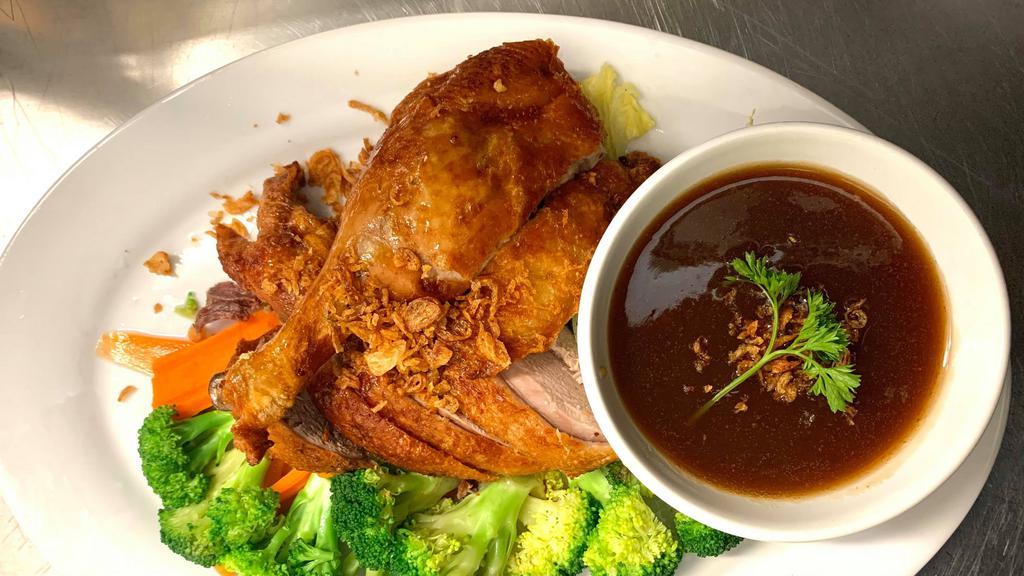Honey Duck · Crispy half duck served with chef's special black honey sauce and steamed veggies. Please let use know if you have any dietary restrictions or food allergies.