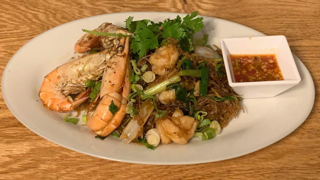 Goong Ob Woonsen · Baked shrimp with glass noodles, ginger, Chinese celery, scallions served with spicy thai sauce. Please let use know if you have any dietary restrictions or food allergies.