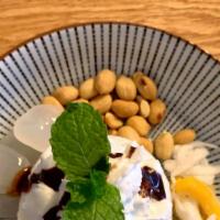 Coconut Paradise · Coconut ice cream served with peanuts, young coconut pulp, palm seeds and sliced jackfruit. ...