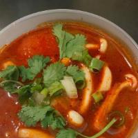Tom Yum · Spicy. Spicy and sour soup seasoned with tomato, mushroom, scallions, onions, lemongrass and...