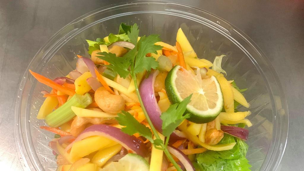 Mango Salad · Spicy. Fresh mango, tomato, cashew nut, celery, onions with spicy lime dressing. Please let use know if you have any dietary restrictions or food allergies.