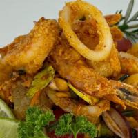 Duo Salad  · Crispy shrimp and calamari red onion carrot tomato cashew nut with chili paste lime sauce .