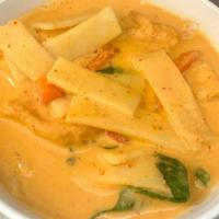 Red Curry · Spicy. Red curry paste with bamboo shoot, fresh basil and bell peppers simmered in coconut m...