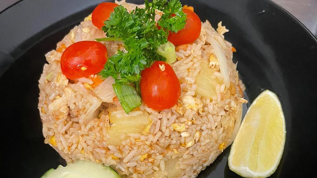 Pineapple Fried Rice · Stir fried with pineapple, onion, carrot, scallions, cashew nut and egg. Please let use know if you have any dietary restrictions or food allergies.