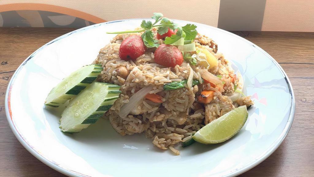 Crab Meat Fried Rice · Stir fried rice with lump crab meat, egg, served with chili fish sauce on the side. Please let use know if you have any dietary restrictions or food allergies.