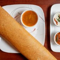 Masala Dosa · Crepe (made with rice and lentil dough) stuffed with potatoes, onions and nuts.
