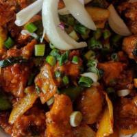 Chili Chicken · Fried boneless chicken pieces sauted with onions, bell peppers, ginger, garlic, herbs in soy...