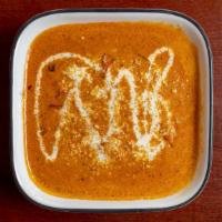 Paneer Butter Masala · Cottage cheese cubes cooked with butter and curry sauce.
