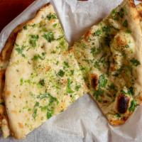 Chilli Garlic Naan · Soft flour bread patted with minced garlic, minced chillies and baked in a tandoori oven and...