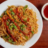 Vegetable Hakka Noodles · The traditional noodle cooked with vegetables and spring onions.