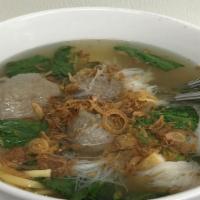 Tennis Meat Ball · Meatball soup served with egg noodle, vermicelli, fried tofu, and yu choy.